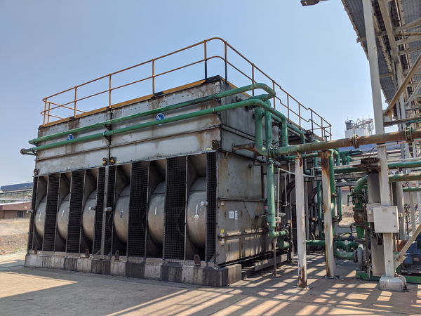 Industrial cooling towers and green pipework