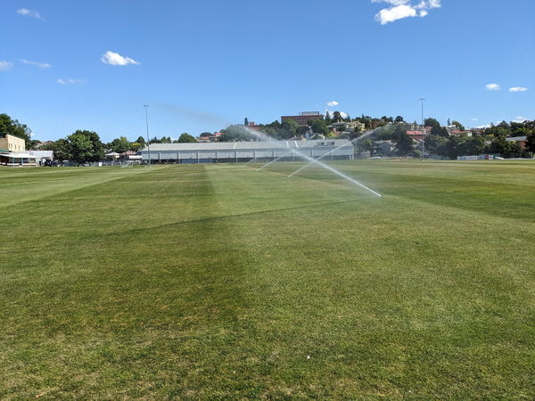 Sprinklers irrigating a sports field